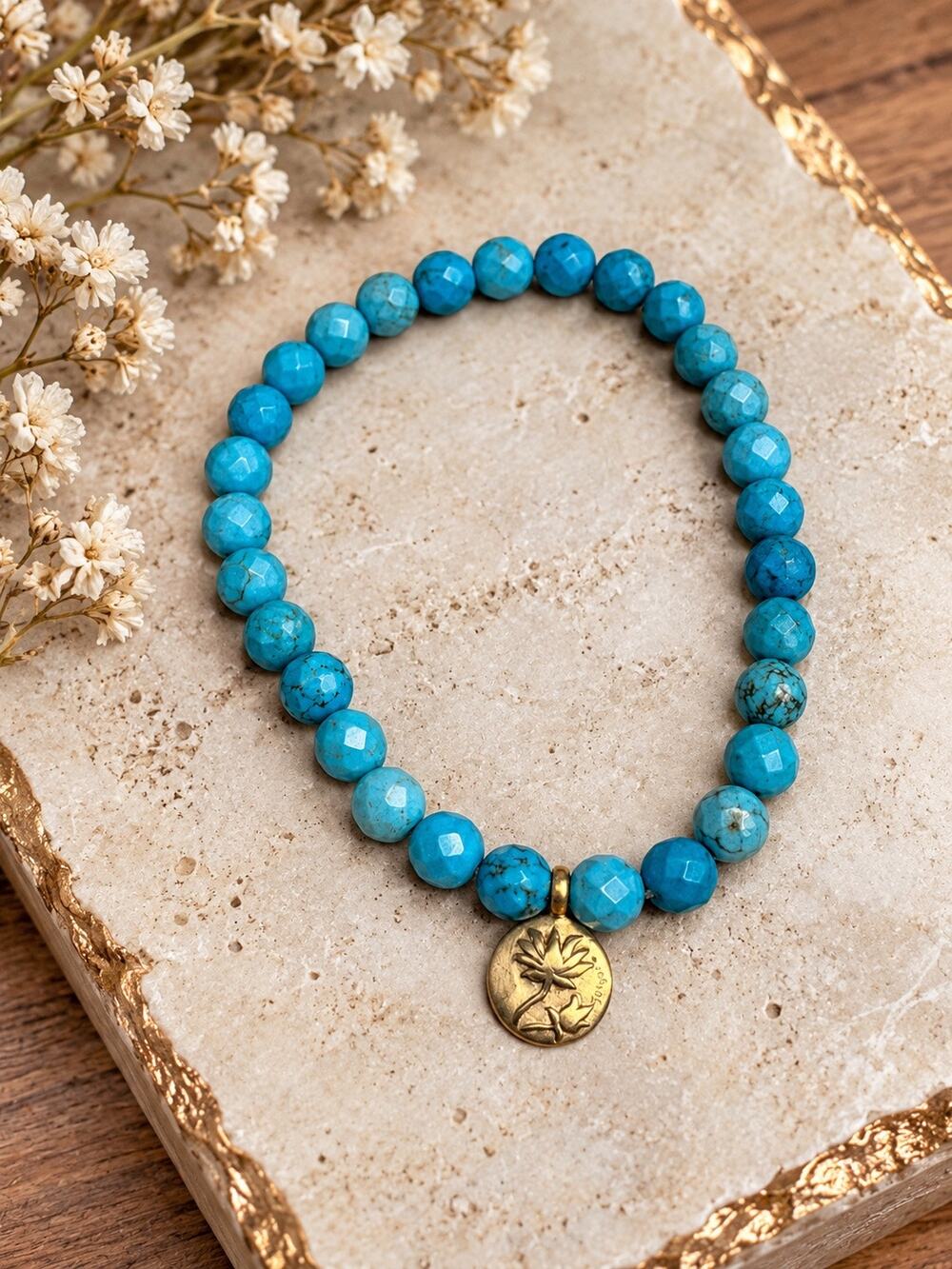 Satya Turquoise Lotus Gold Tone Stretch Bracelet